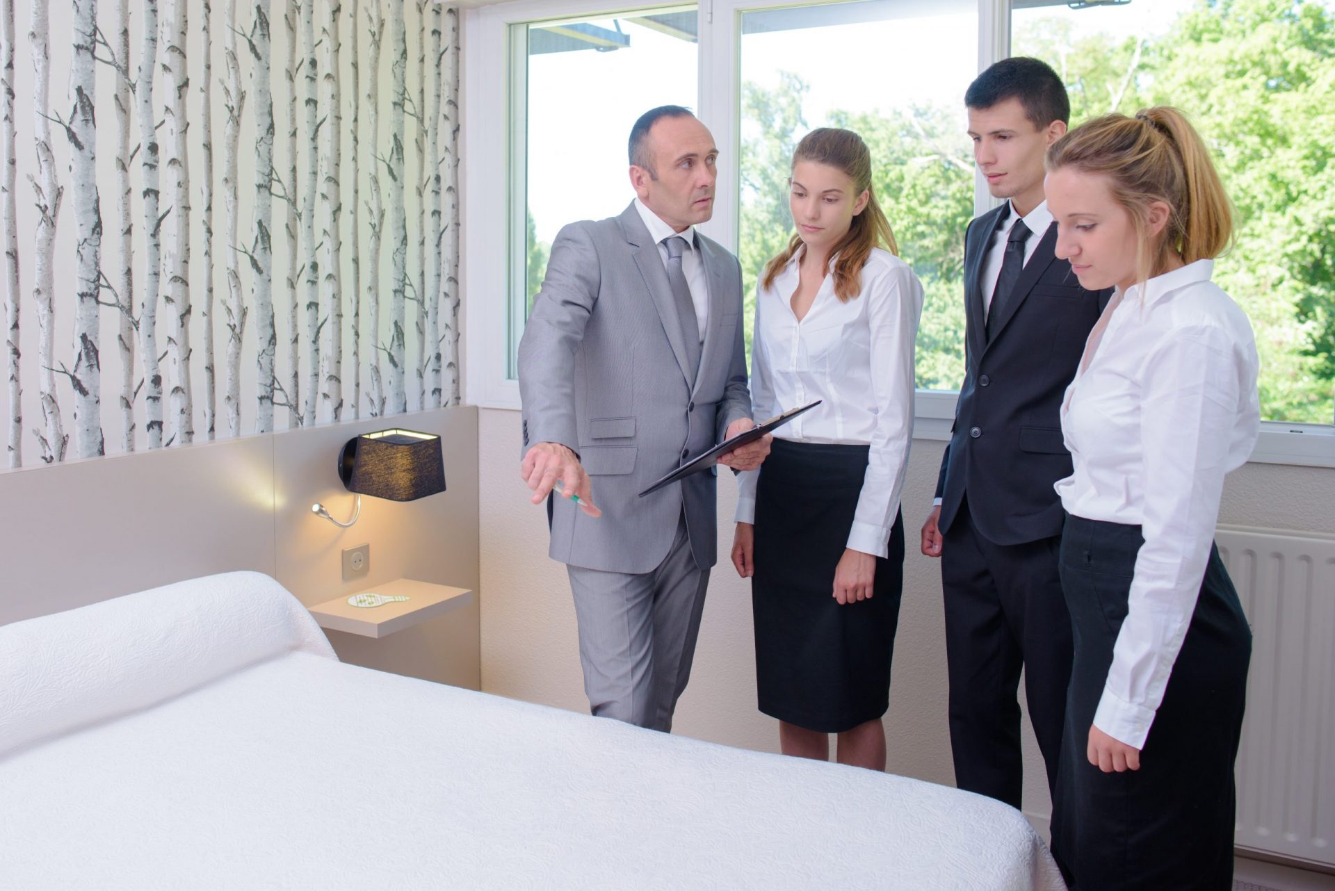 Group of staff and management go over hotel operations