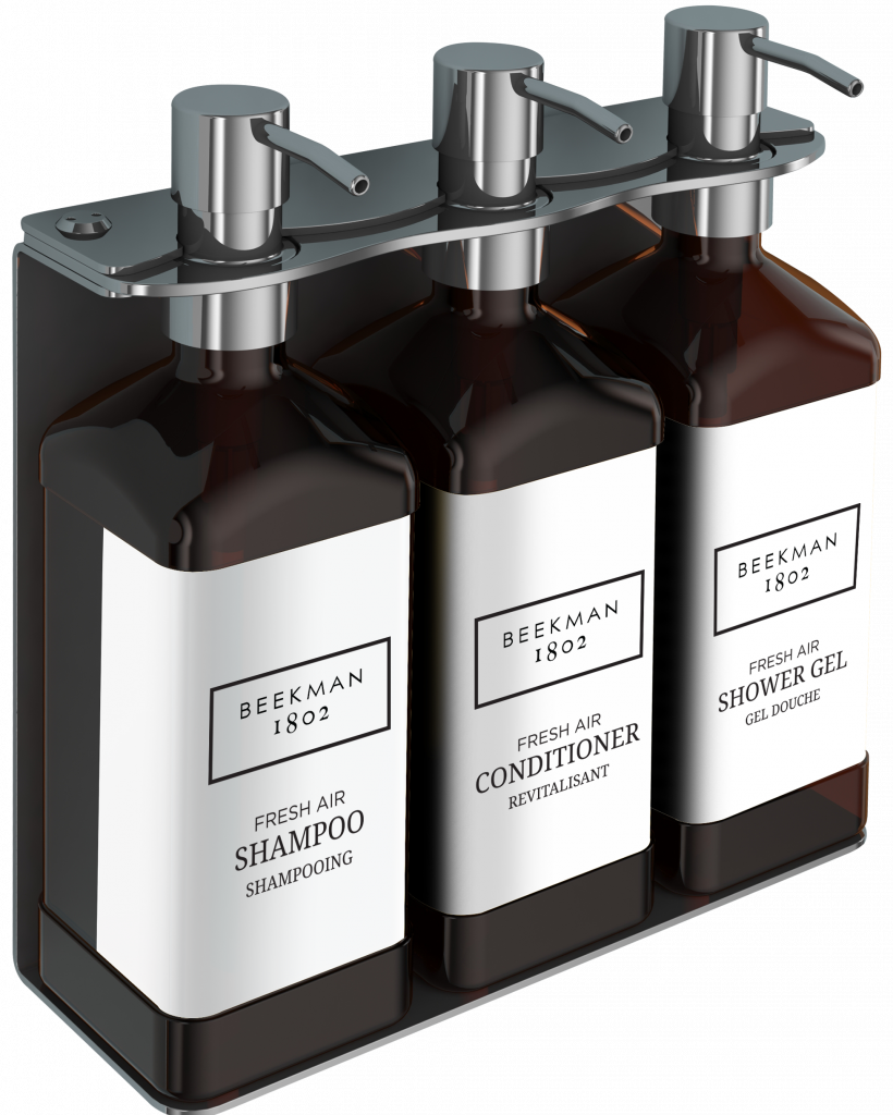 photo of Beekman three-chamber wall-mounted hotel dispenser set, with individual units for Shower Gel, Shampoo, and Conditioner.