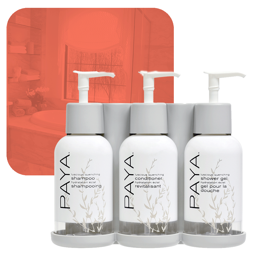 photo of paya three-chamber wall-mounted hotel dispenser set, with individual units for Shower Gel, Shampoo, and Conditioner.