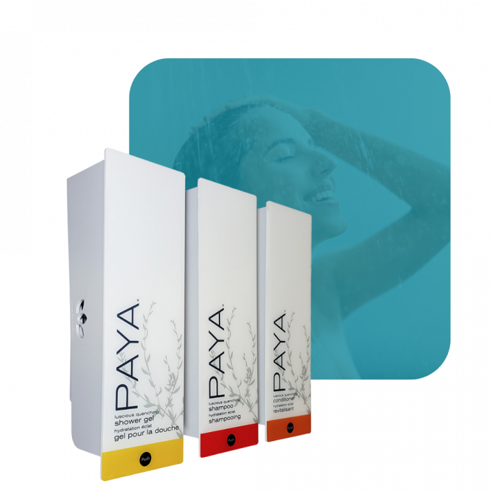 photo of Paya three-chamber wall-mounted hotel dispenser set, with individual units for Shower Gel, Shampoo, and Conditioner.